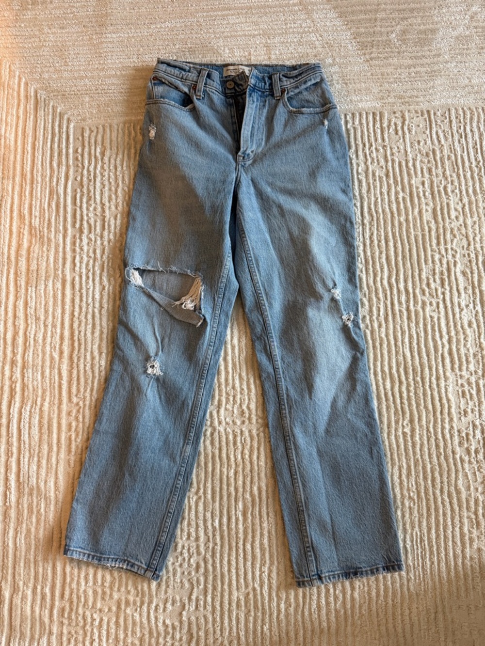 Woman’s Light Blue Distressed Jeans